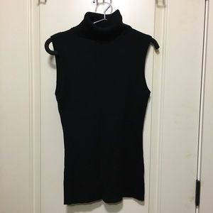 Black Ribbed sleeveless turtleneck sweater.